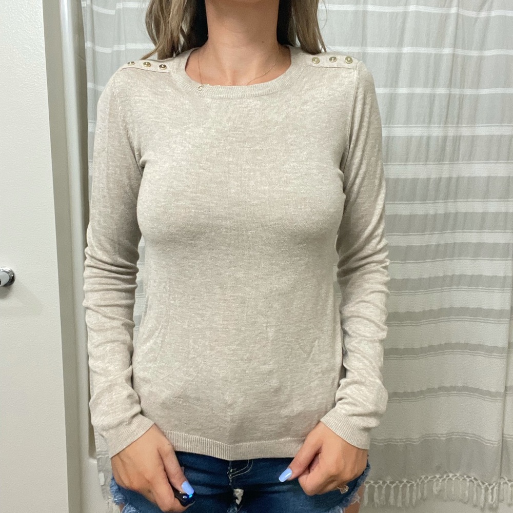 Beige sweater with gold buttons on shoulder